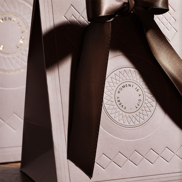 Gift wrap, gift bag, in kit embossed gold every moment is a gift, with brown ribbon